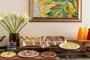 Breakfast buffet detail with cheeses, bread, cold cuts and juices, carefully prepared for guests in Liguria - Hotel Al Sant'Andrea, BZAR hotels in Liguria