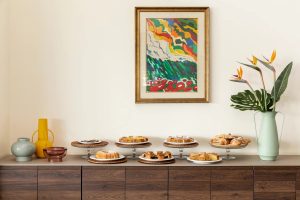 Sweet breakfast buffet with croissants and cakes on stands, stylish setting to start the day in Sarzana, Liguria - Hotel Al Sant'Andrea, BZAR hotels in Liguria